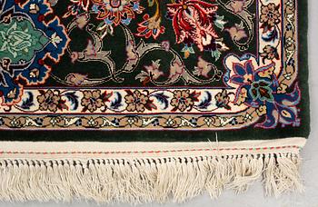 A rug, old Esfahan, part silk, signed, ca 225 x 149 cm (ca 1,5-2,5 cm flat weave at the ends).