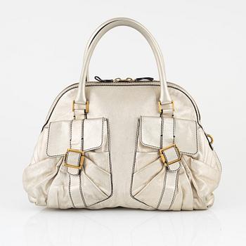 Valentino Garavani, A metallic leather bag.