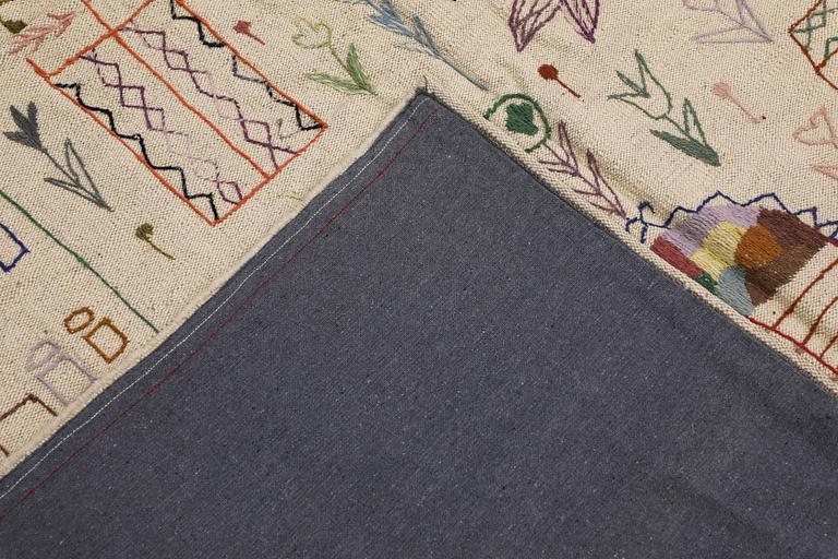 A Kelim rug, hand-embroidered, 241 x 179 cm.