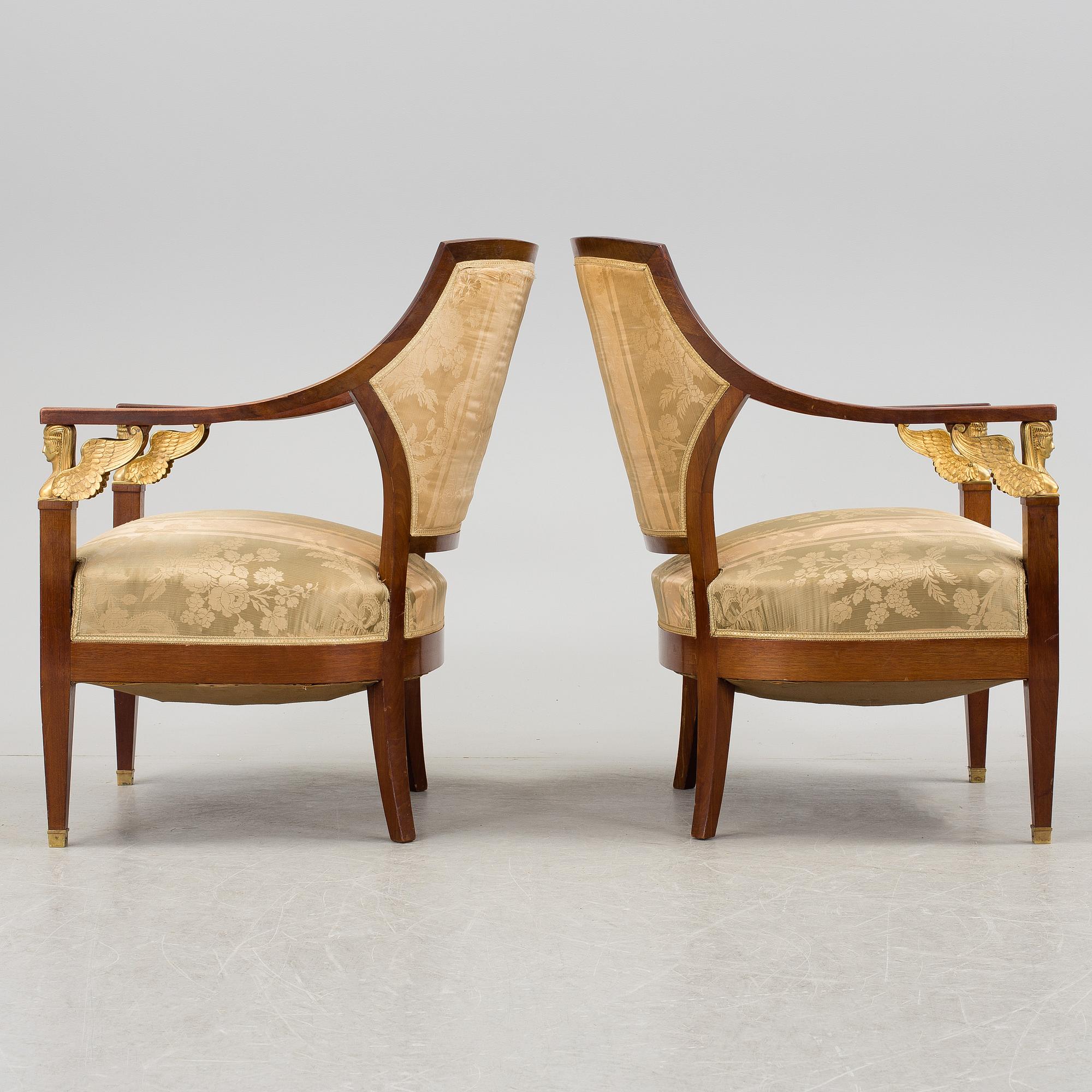 A pair of early 20th century Empire style armchairs.