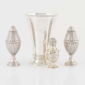 Three Silver Shakers and a Beaker.