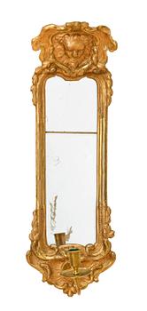 A pair of Swedish Rococo 18th century one-light girandole mirrors.