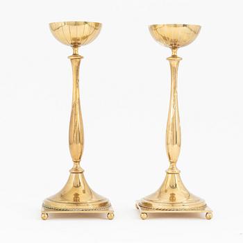 Gunnar Ander, a pair of brass candlesticks, Ystad metall, mid 20th Century.