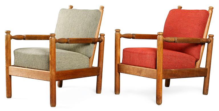 A pair of Axel-Einar Hjorth stained pine armchairs 'Sandhamn' by Nordiska Kompaniet ca 1929.