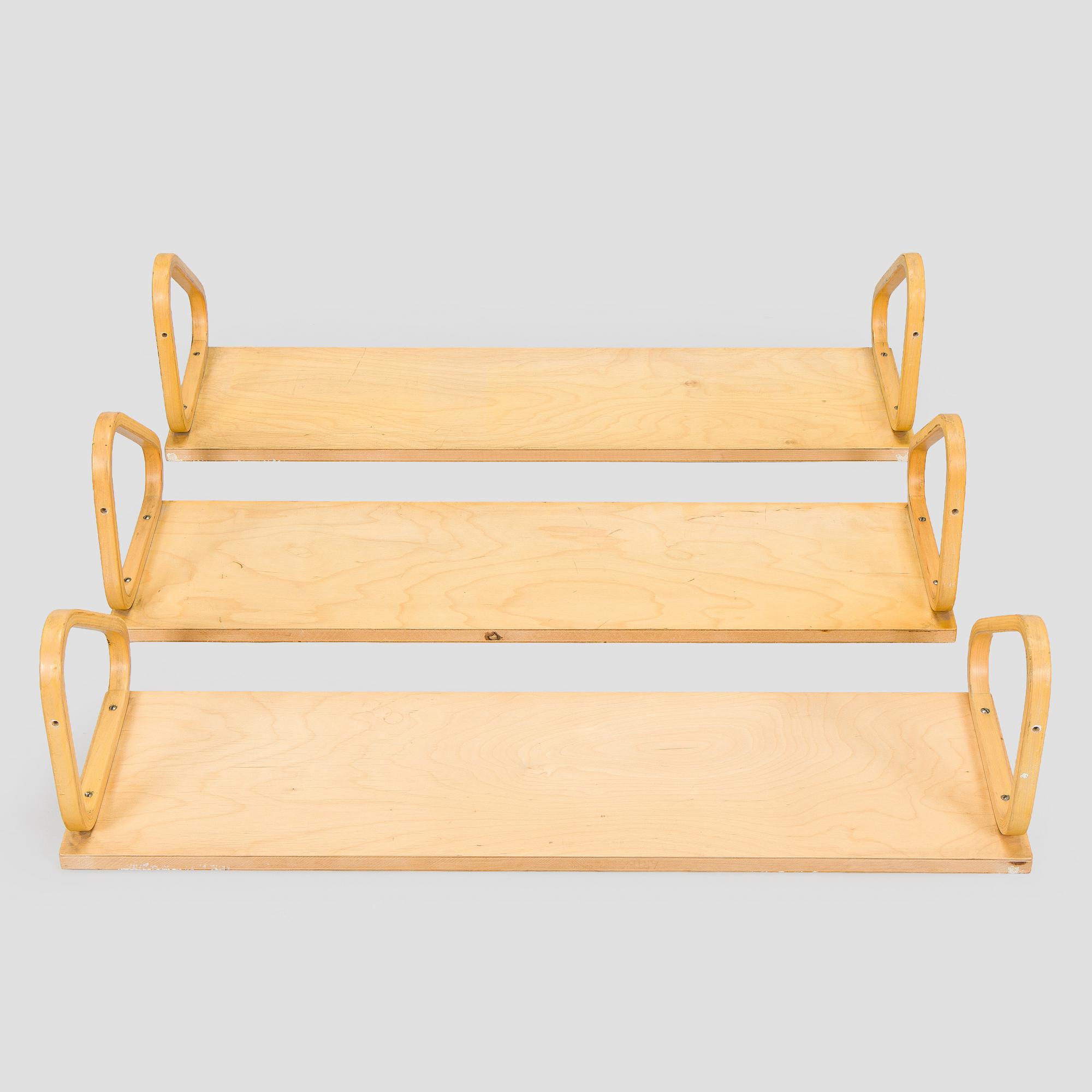 Alvar Aalto, three '112B' shelves, Artek, late 20th century.
