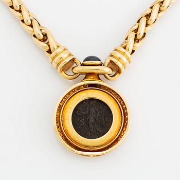 An 18K gold and ancient coin necklace set with a sapphire, a ruby and round brilliant-cut diamonds.