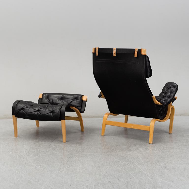 BRUNO MATHSSON, easy chair and foot stool, 'Pernilla', Dux, second half of the 20th century.