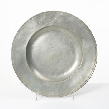An English baroque pewter charger, dated 1672.