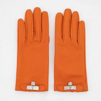 Hermès, a pair of orange kidskin and lambskin gloves, french size 8.