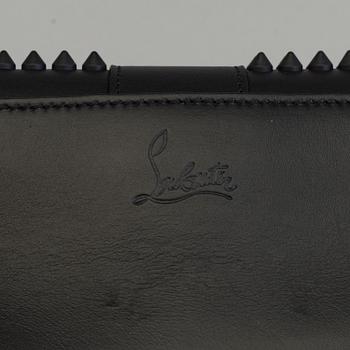 An eveningbag with studs by Christian Louboutin.