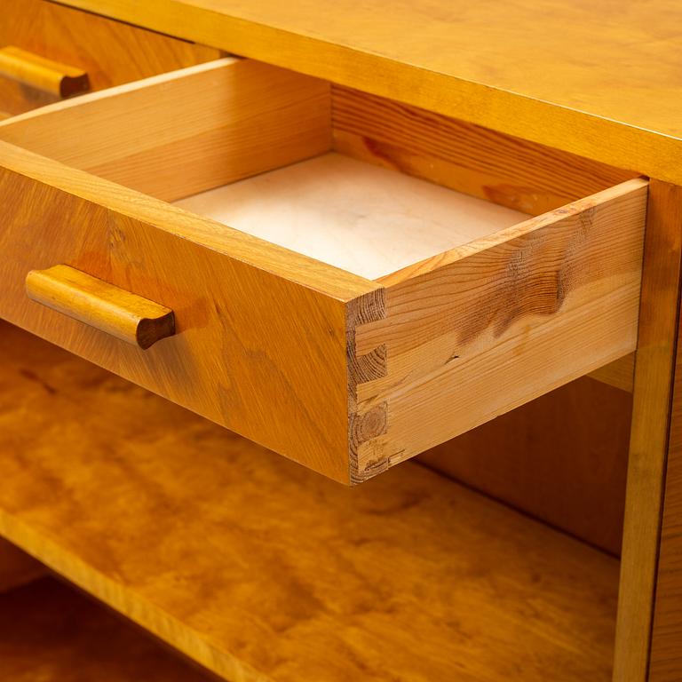 A 1930s birch and elm veneered shelf.