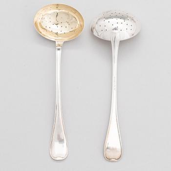 A pair of lidded silver sugar bowls with sprinkle spoons, mark of The Firm Carl Fredrik Carlman, Stockholm 1928-29.