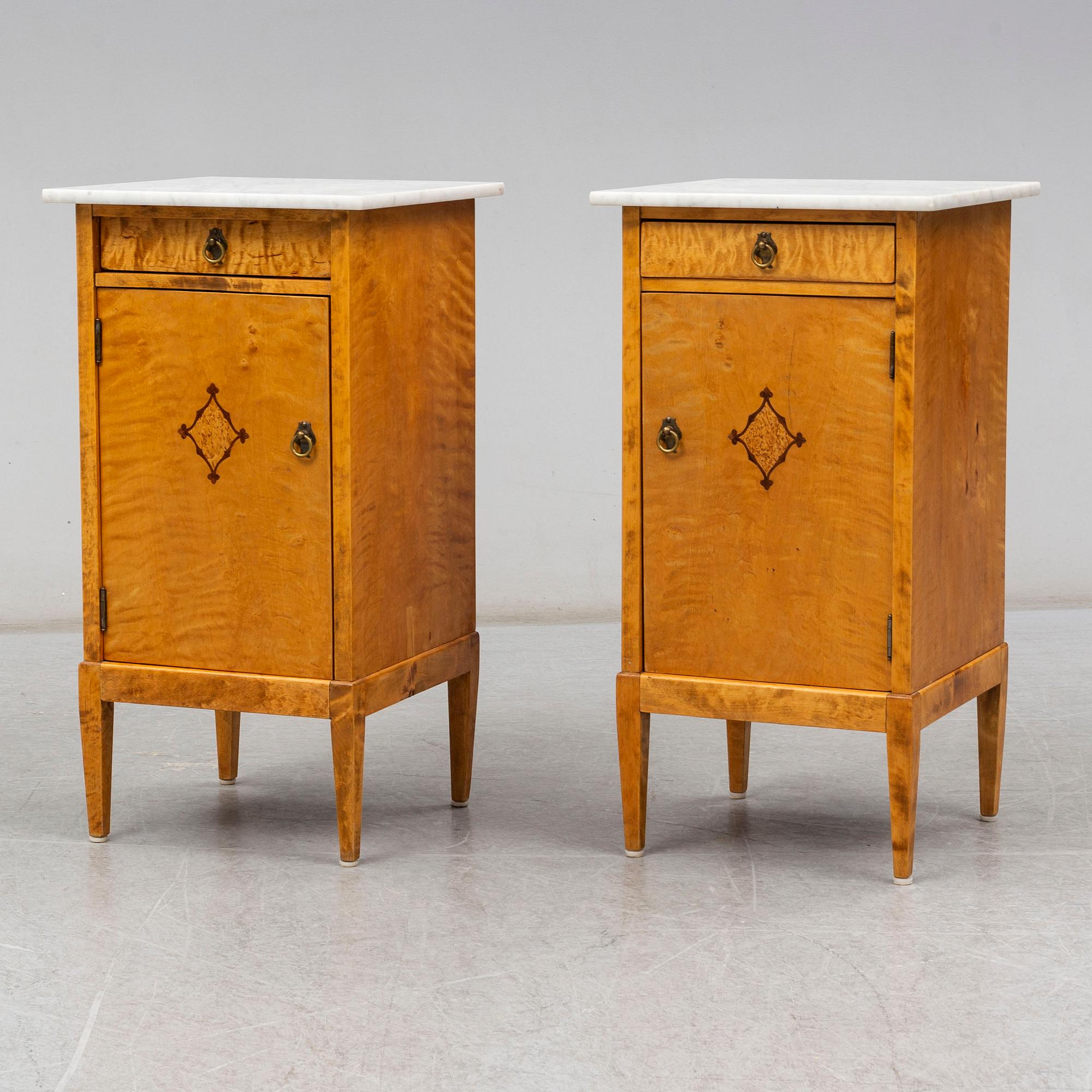 A pair of bedside tables from the first half of the 20th century.