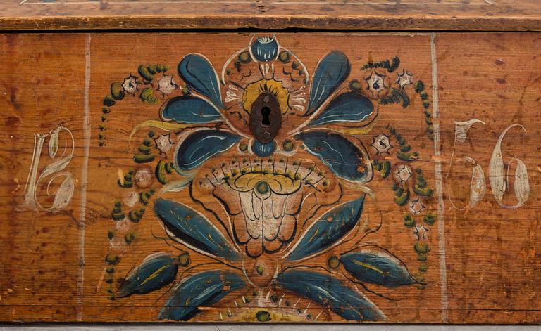 A wooden chest, dated 1856.