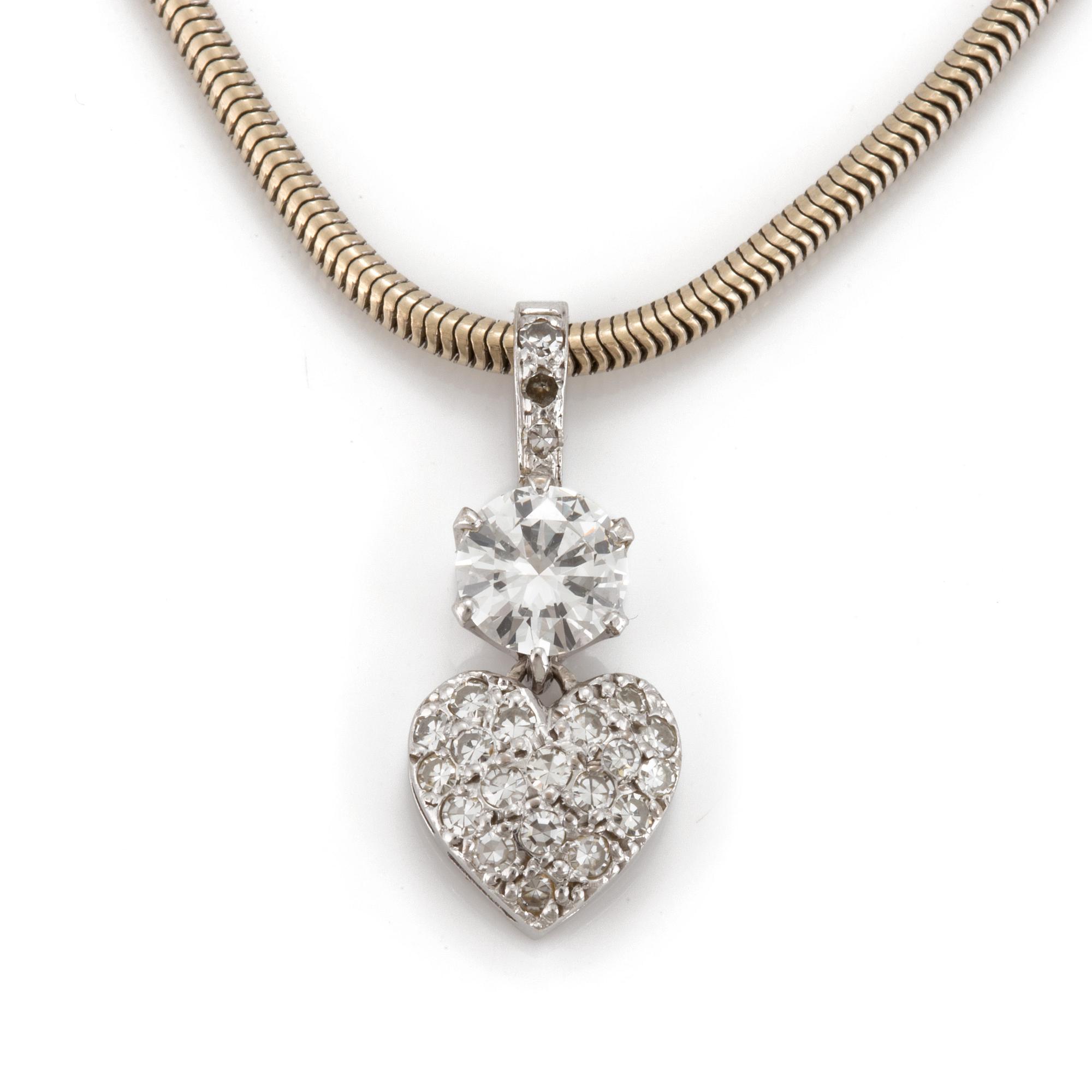 A chain and a pendant set with eight-cut and a round, brilliant-cut diamond.