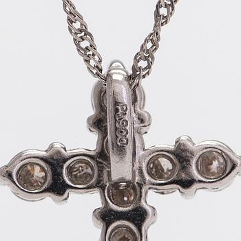 A platinum necklace with a cross pendant set with brilliant-cut diamonds 0.50 ct acording to engraving.