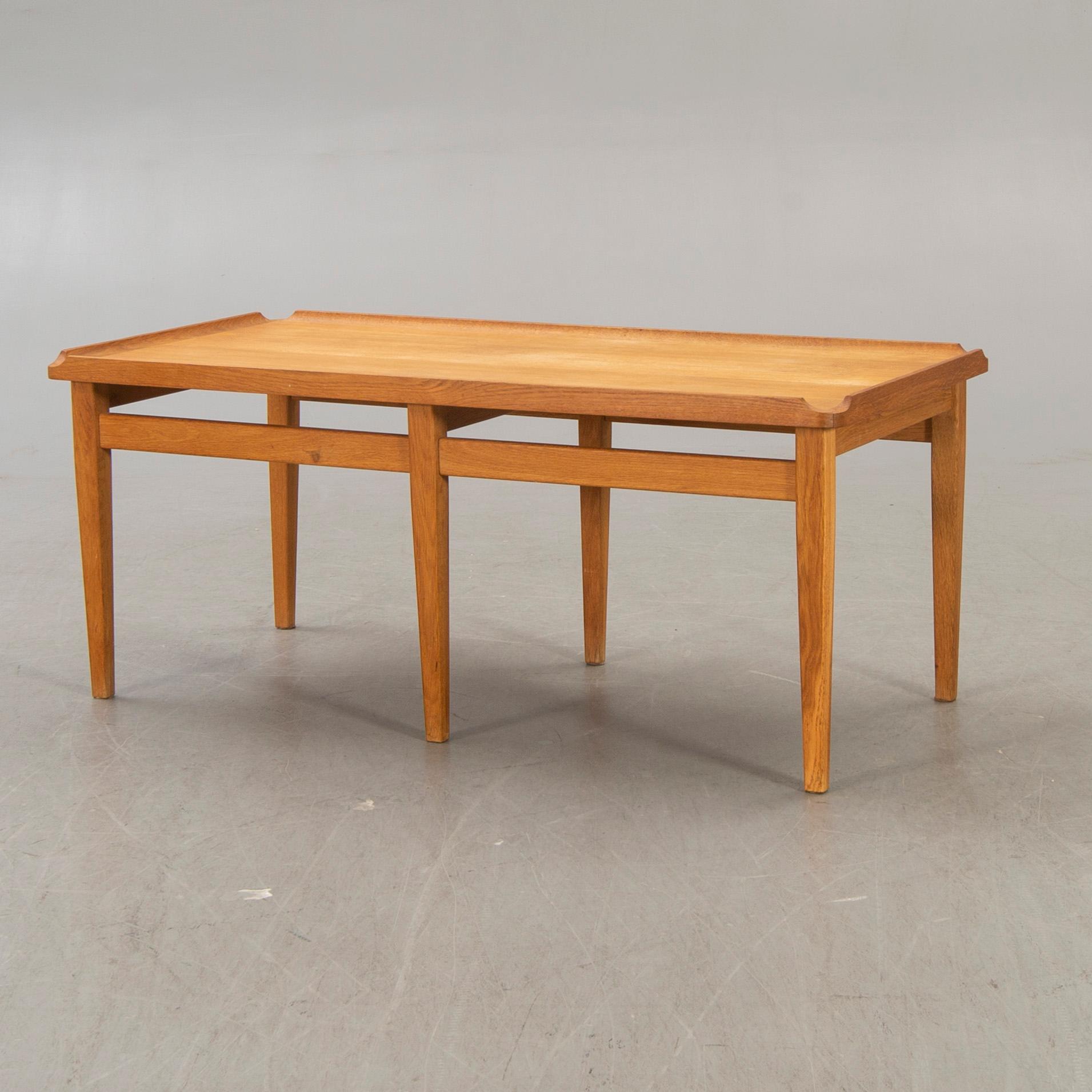 A 1960s oak coffee table.