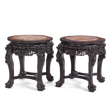 1018. A pair of Chinese hardwood marble top tables, circa 1900.