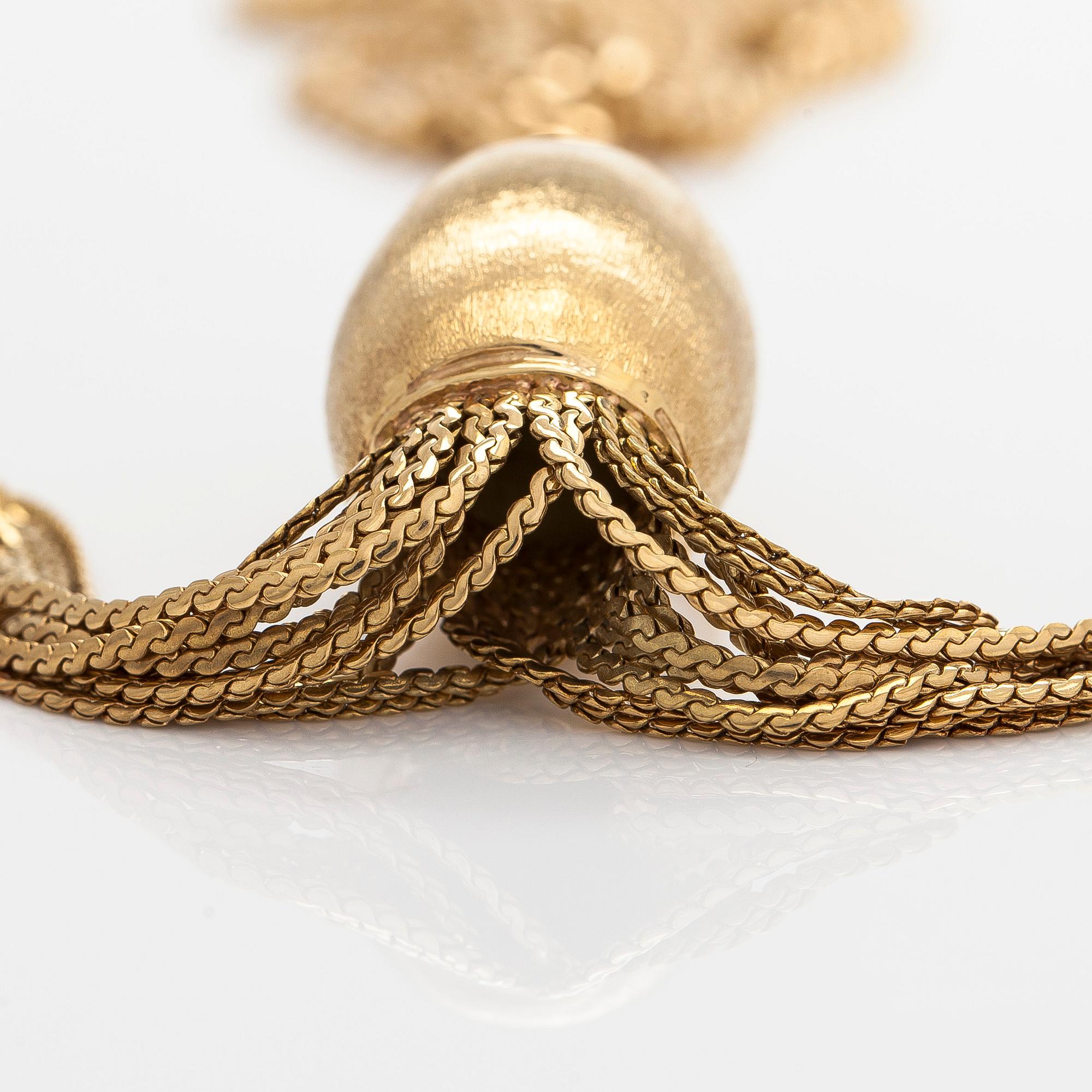 Kaulakoru, 14K ja 18K kultaa, tupsuriipuksella. Sveitsi ja Italia.