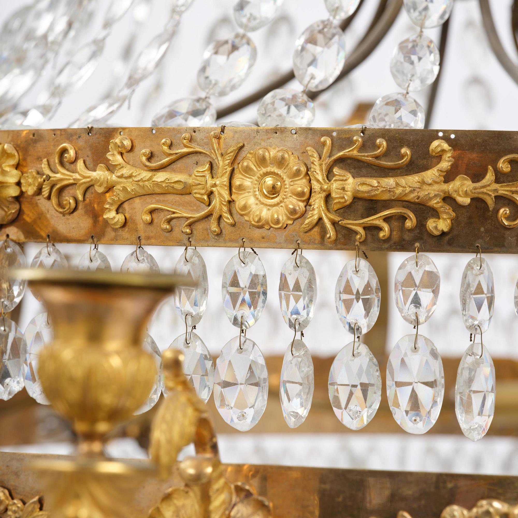 An ormolu and cut glass sixteen-branch Empire chandelier, Paris, early 19th century.