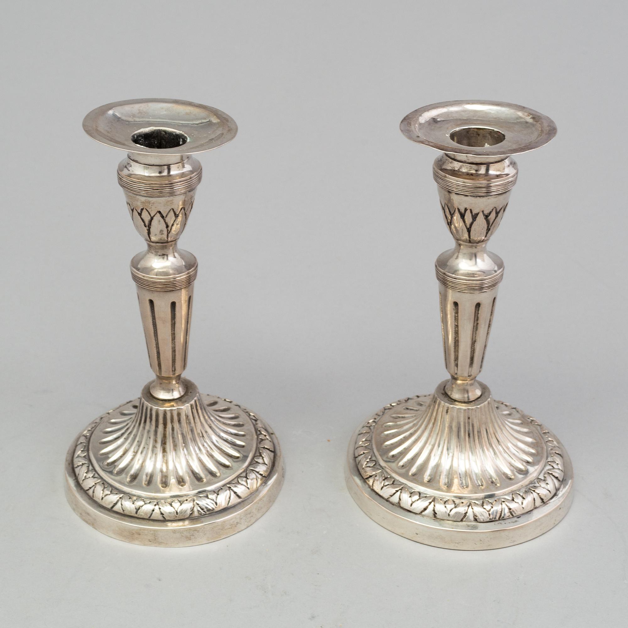 A pair of late 18th century silver candlesticks with unclear hallmarks, possibly from Germany. Weight ca 316 grams.