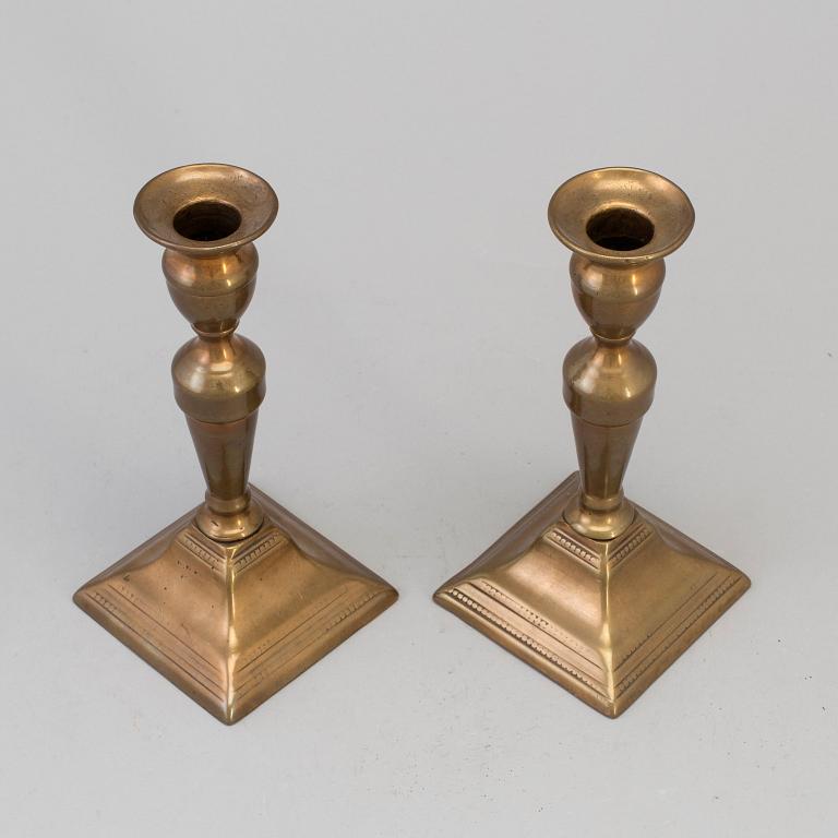 A PAIR OF BRONZE CANDLESTICKS, first half of the 19th century.