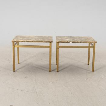 A pair of metal and stone side tables from the second half of the 20th century.