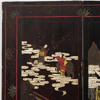A Chinese four panel lacquer folding screen, first part of the 20th century.