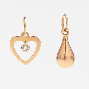 Two 14K gold pendants one with a diamond ca. 0.0025 ct.