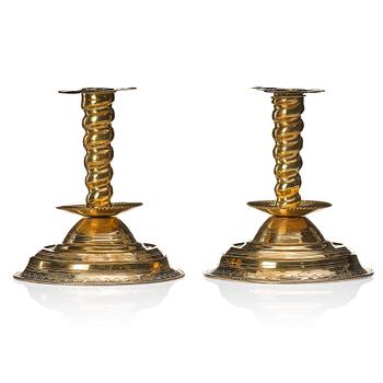 125. A pair of late Baroque candlesticks.