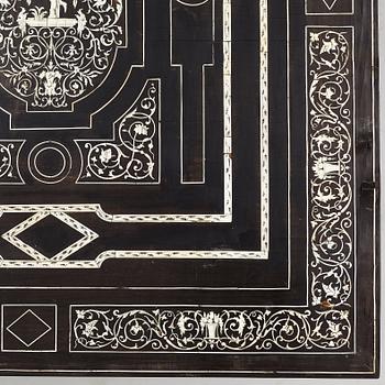 A Renaissance-style ebony, ebonized and ivory-inlaid library table, late 19th century, presumably Germany.