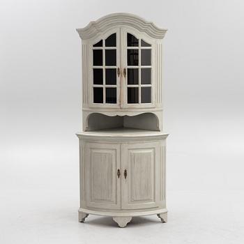 A Gustavian style 20th century corner cabinet.