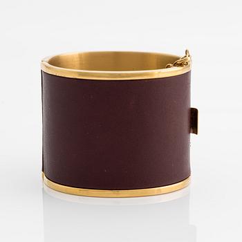 Céline, bangle, gold-tone metal and leather.