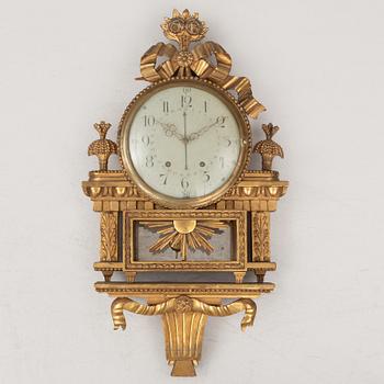 A Gustavian wall clock, late 18th century.