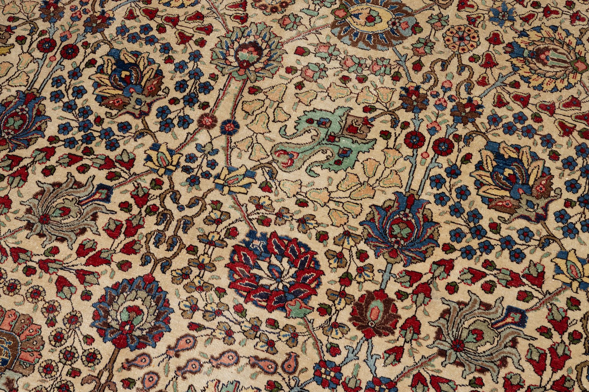 A Tabriz carpet, c. 385 x 287 cm.
