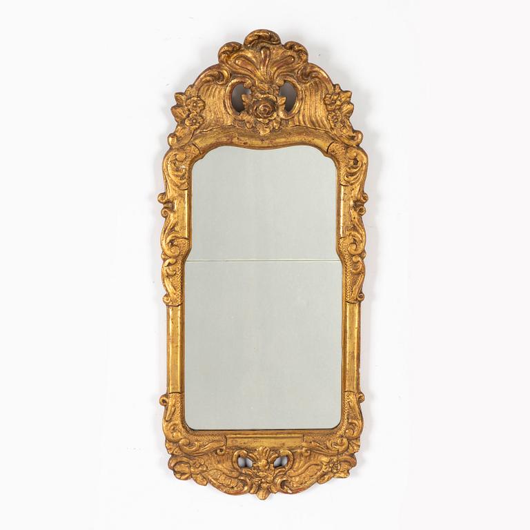 A Rococo mirror, 18th Century.