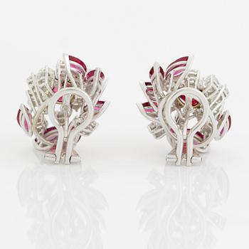 A pair of 18K white gold earrings set with faceted rubies and round brilliant-cut diamonds.