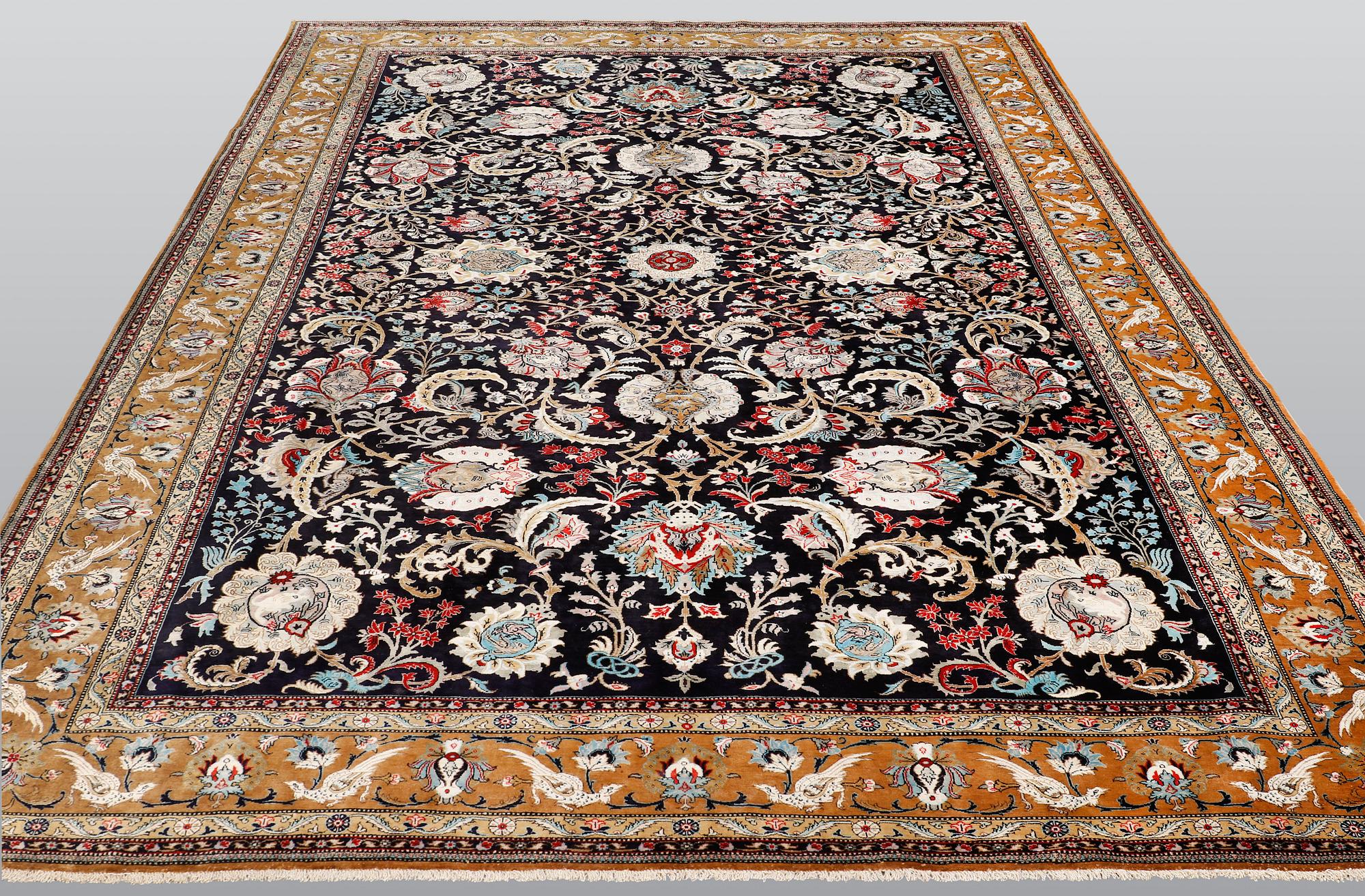 A Ghom silk carpet, approx. 309 x 200 cm.