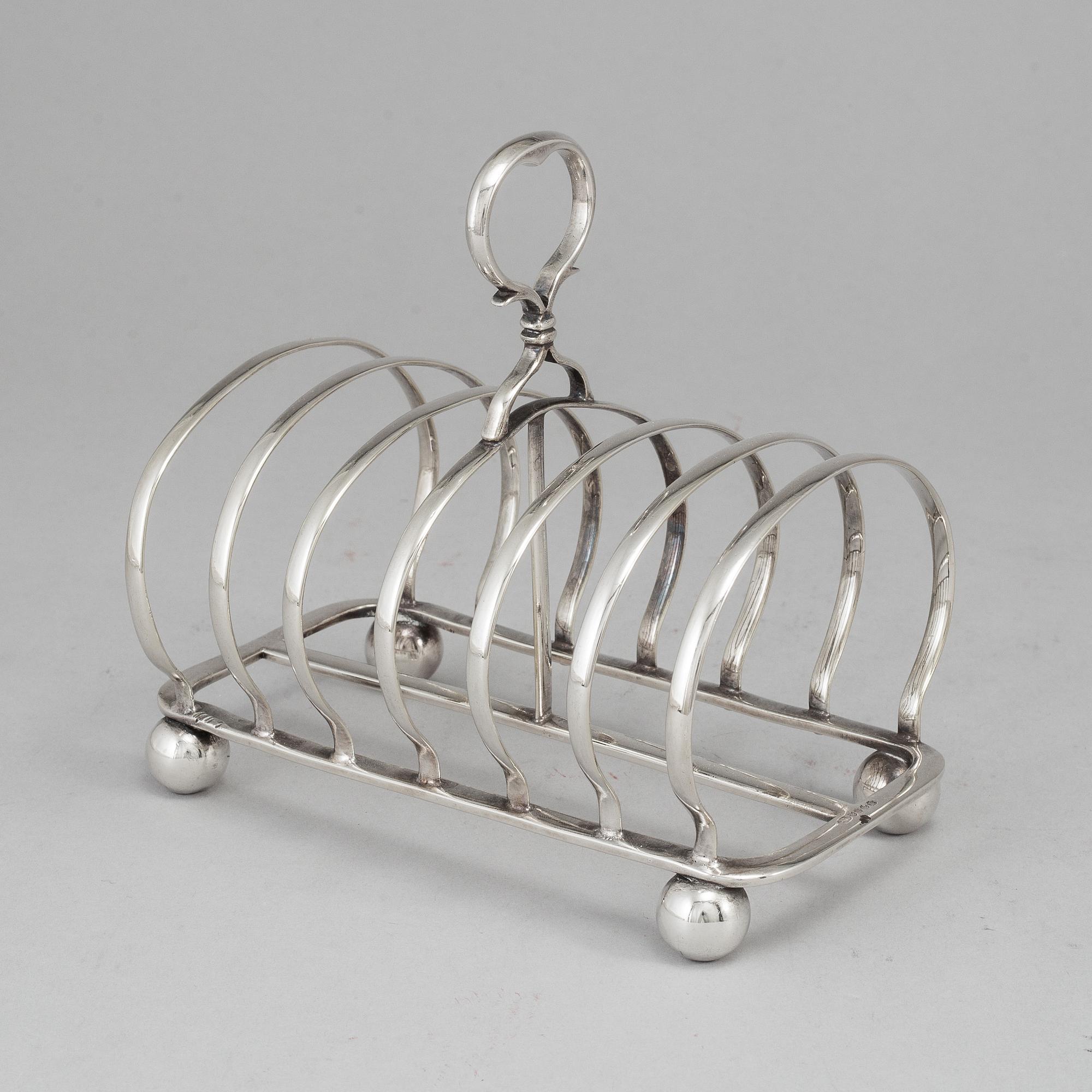An English 20th century silver-plated toast rack, marked WH.