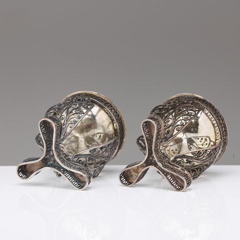 A pair of 19th century parcel-gilt silver salt-cellars, unidentified marks.