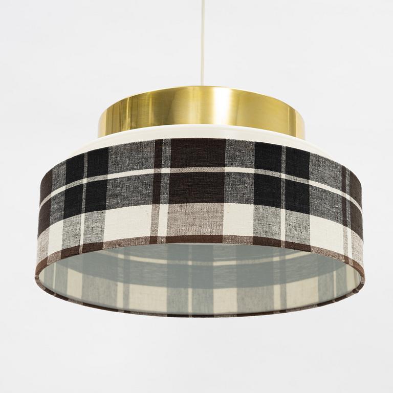 A brass and textile ceiling light. Luxus, Vittsjö.