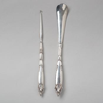 Georg Jensen, a shoehorn and a tool for tying shoe laces, Copenhagen ca 1918-20, 830/ 1000 silver.