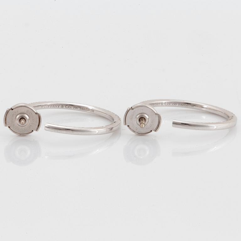 A pair of Tiffany "Metro" 18K white gold hoops set with round brilliant-cut diamonds.
