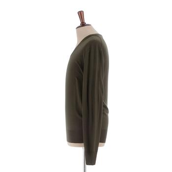 YVES SAINT LAURENT, a men's green wool sweater, size M.