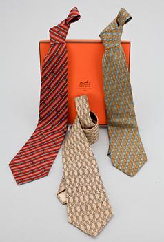 1313. A set of three silk ties by Hermès.