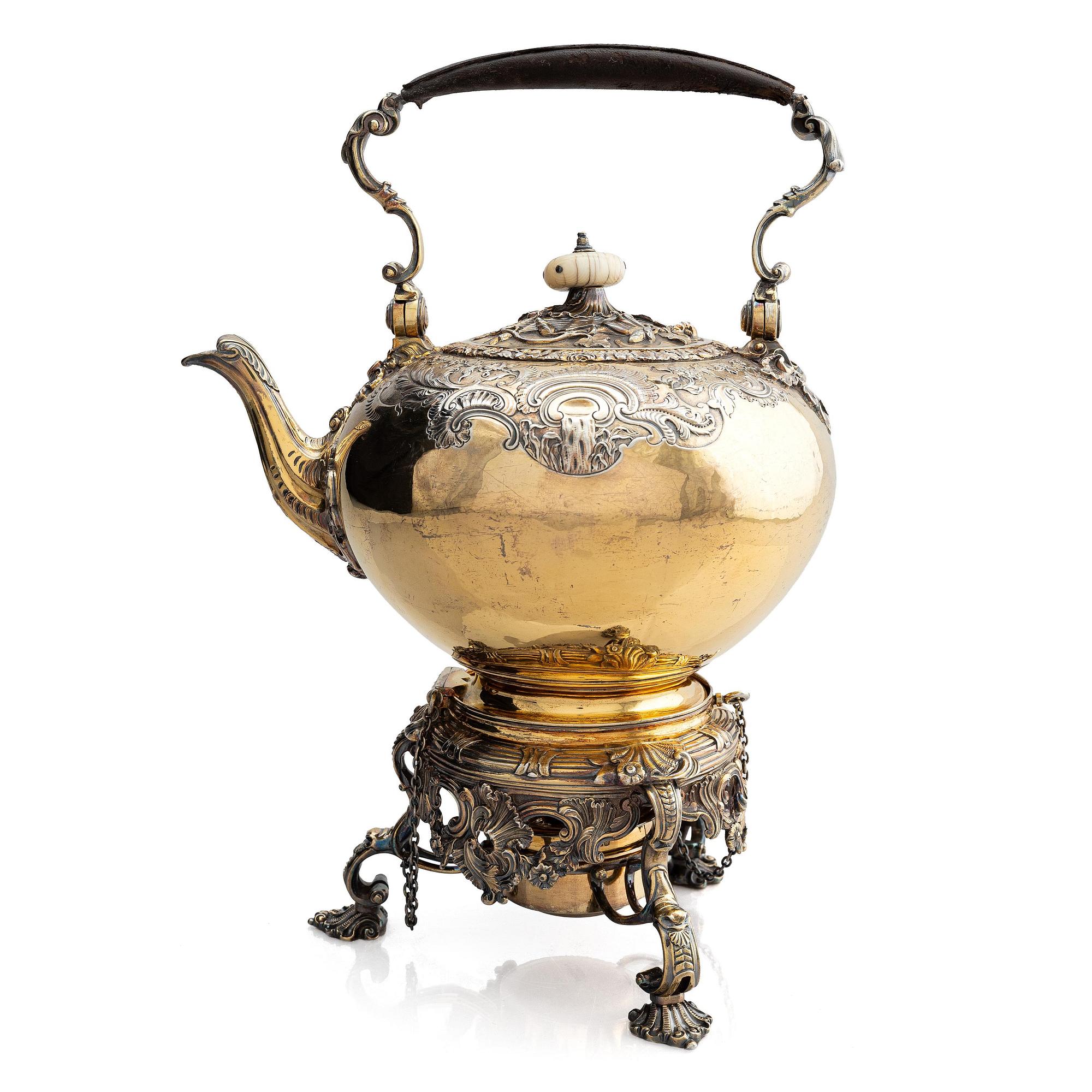 An English silver-gilt teapot with stand and burner, mark of Richard Sibley I, London 1825.