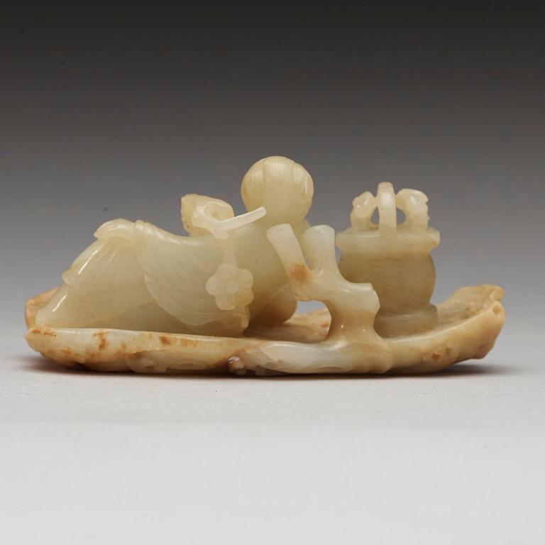 A Chinese nephrite figure of a lady with a flower basket, qing dynasty (1644-1912).