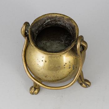A 17th century brass bowl.