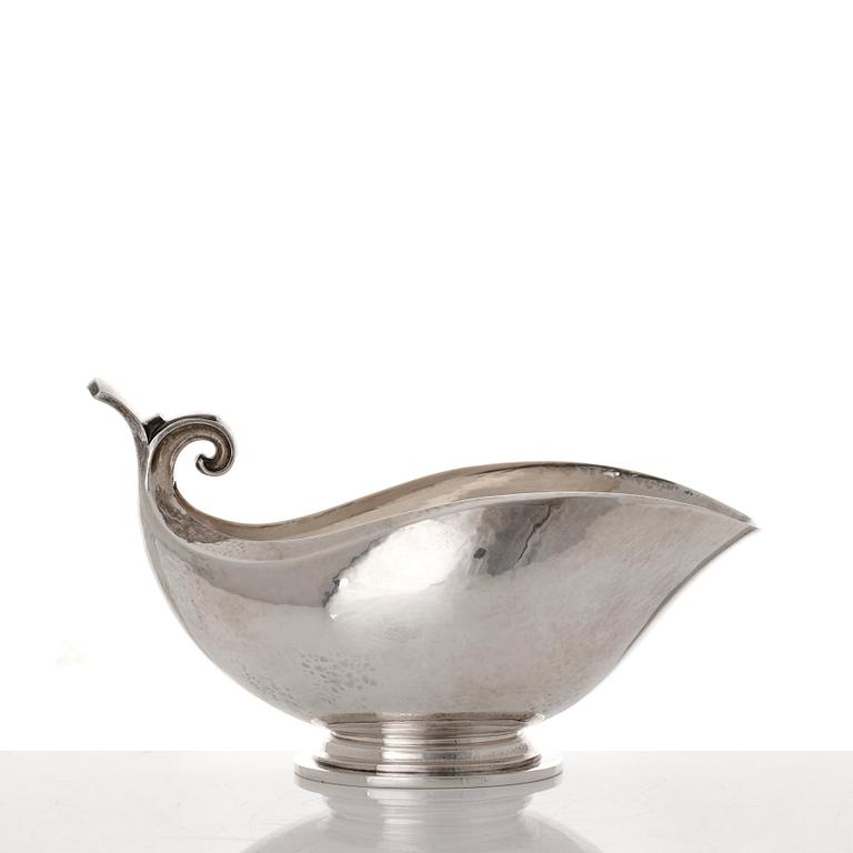 Georg Jensen, a sterling silver sauceboat and ladle, Copenhagen 1925-1945, design nr 98 and 141.