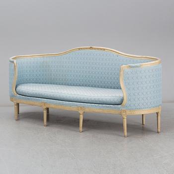 A Gustavian sofa, circa 1900.